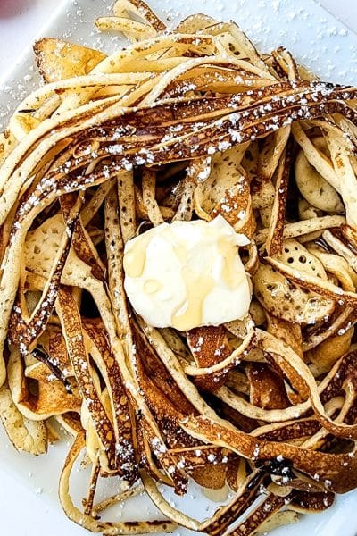 above shoot close up of pancake spaghetti with butter on top